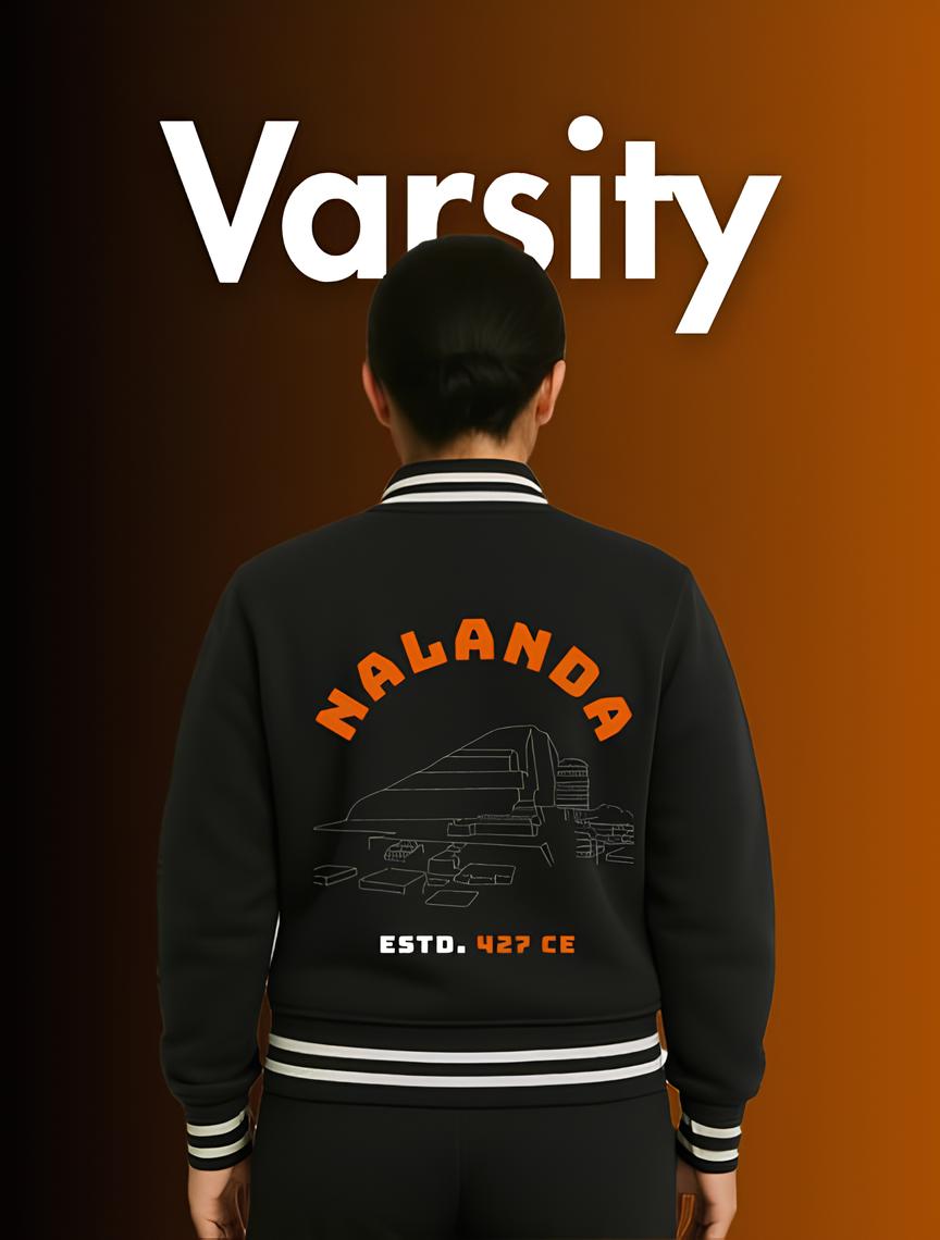 Black cultural varsity jackets featuring Nalanda design and striped collar and cuffs worn by person facing away