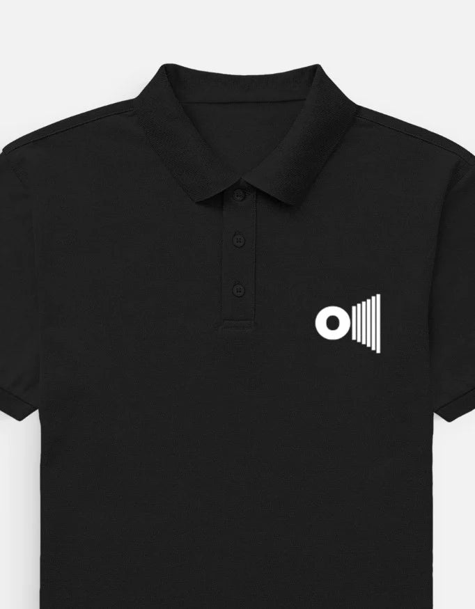 Outspoken premium black polo shirt with collar and button placket featuring white logo on chest