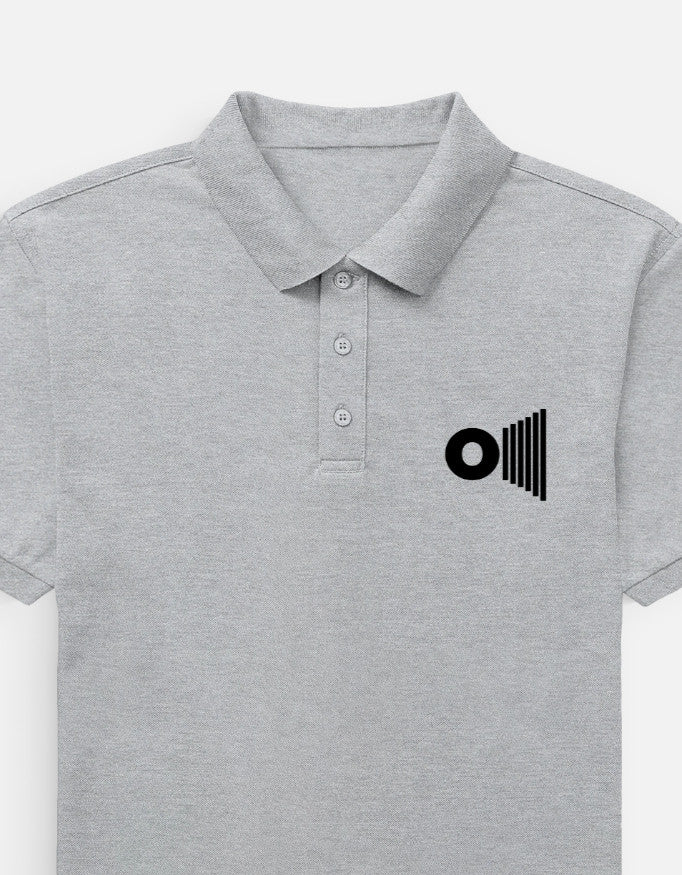 Outspoken premium gray polo shirt with collar and three-button placket featuring a black logo on the chest