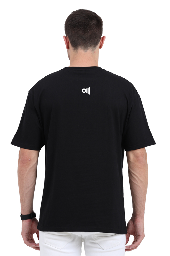 Back view of man wearing black Satyamev Jayate t-shirt by Outspoken with small logo on upper back