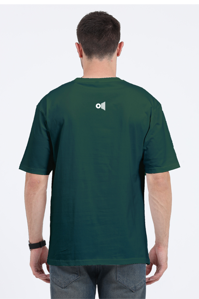 Back view of a man wearing a green Satyamev Jayate t-shirt by Outspoken with a small white graphic on the upper back